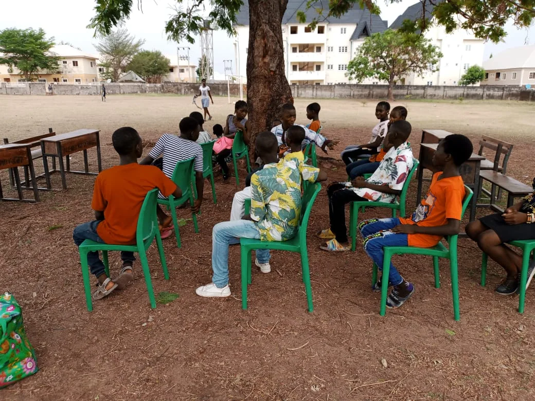 Children participating in a community learning circle
