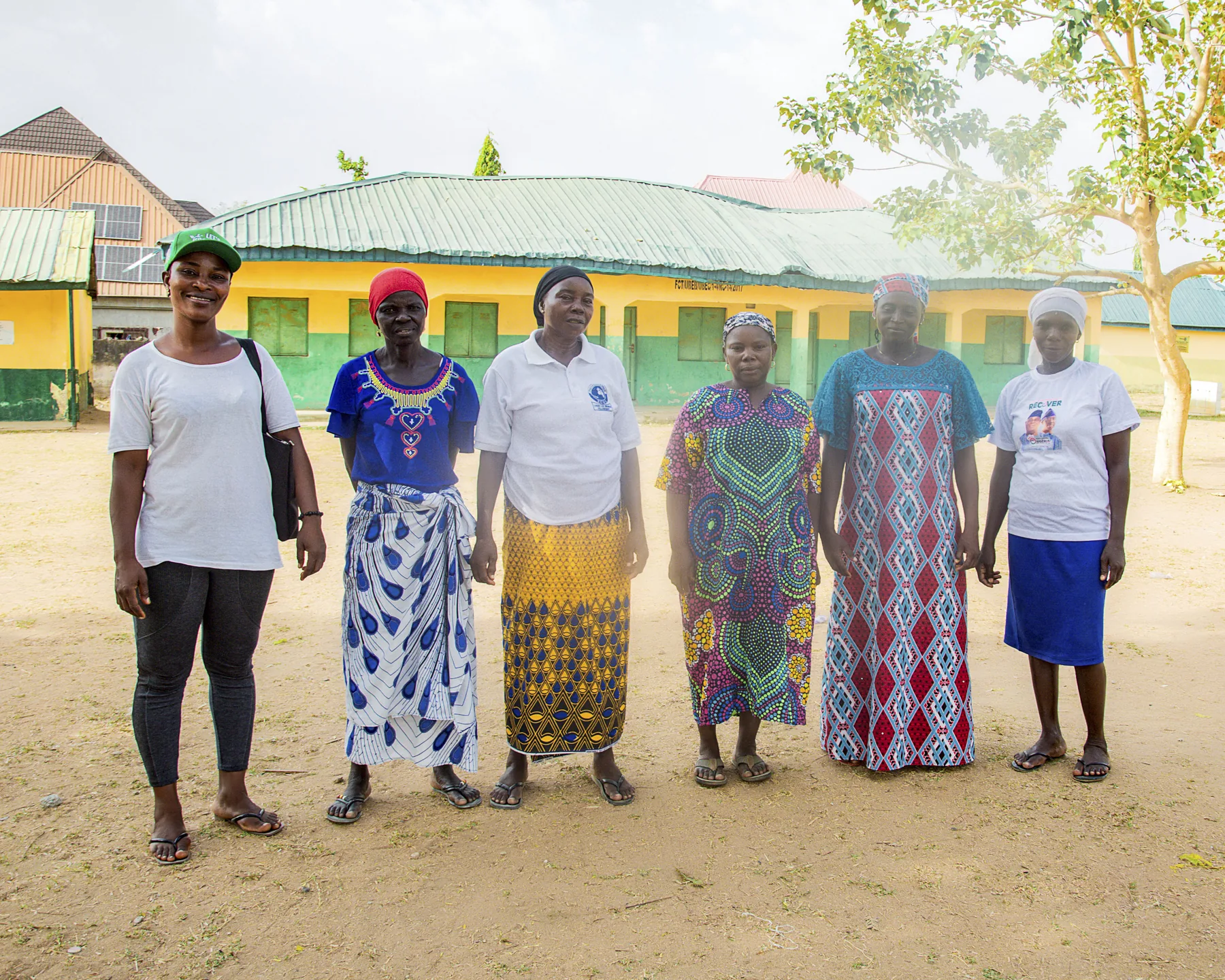 Women and community participants gathered for an outreach session
